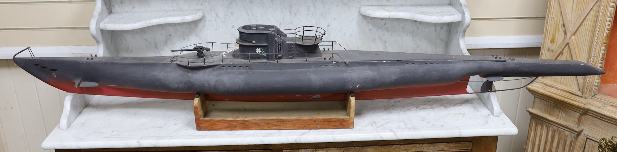 A painted wood model of a German U boat, 170 cms long